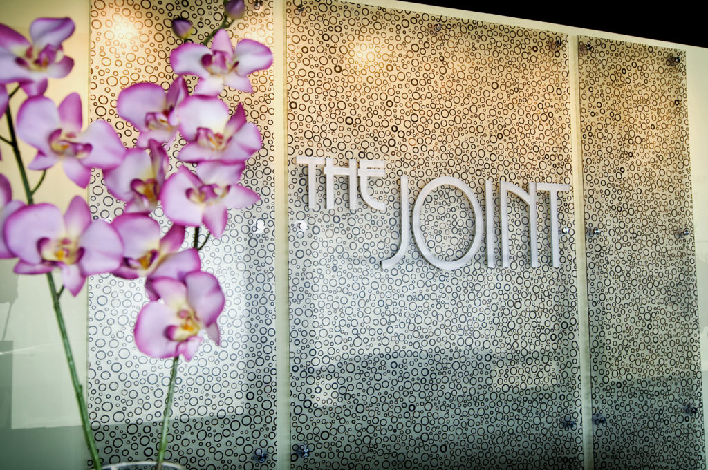The Joint Chiropractic Franchise store logo